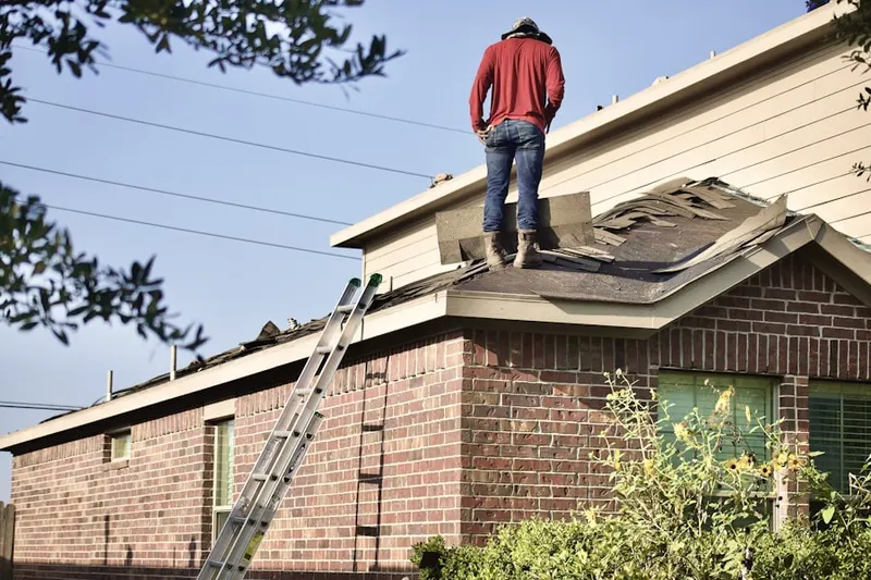 Professional roofer working on a residential roof in Stony Run